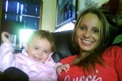 Cara Lynn Hiebert, seen here with one of her children, was 31-years-old and a mother of four, when construction workers discovered her badly beaten body in the basement of her home at 506 Redwood Ave., on July 19, 2011.