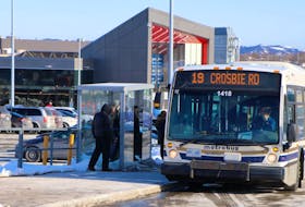 A Metrobus bus picks up passengers in St. John's. — File photo
