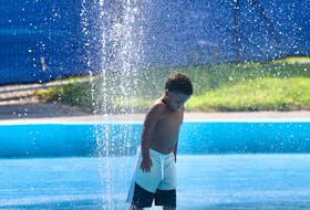 Tridell Smith, 4, cools off at a water fountain in the Halifax commons Wednesday, August 3, 2022. A heat warning has been issued for all of Nova Scotia. - Tim Krochak