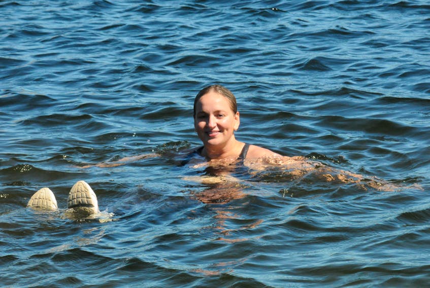 After hiking on Signal Hill, St. John’s resident Stephanie Reid enjoys a dip in George’s Pond on Wednesday, Aug. 31. The pond is now officially open for recreational purposes after many years of locals being prohibited from swimming there or using the pond. At one time, it was used as a backup water supply for the city. Joe Gibbons • SaltWire Network