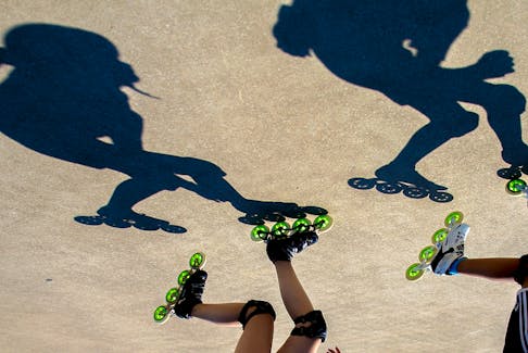 FOR TAPLIN STORY:
The shadows nd skates of Xingyan Han, 13, left and Evan Ren, 12,  members of the Speedy Kids Oval Program Society, are seen doing laps in the Oval in Halifax Thursday August 3, 2022.

TIM KROCHAK PHOTO