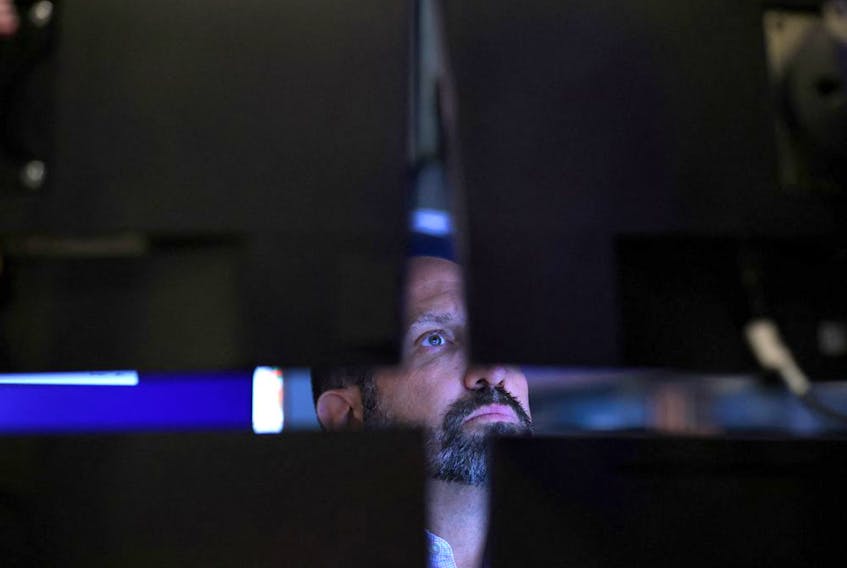 A trader works on the trading floor at the New York Stock Exchange in Manhattan, New York City.
