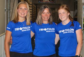 Triathletes Sophie Duncan, left, and Maggie Graves, right, are competing at the Canada Game in the Niagara Region of Ontario with Team Nova Scotia. Shannon Read has been working with the girls since they were eight years old.