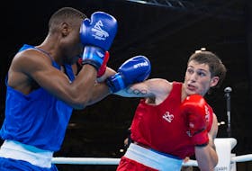 Kennetcook's Wyatt Sanford (right) earned a bronze medal in the men's light welterweight boxing division at the Commonwealth Games on Saturday. - COMMONWEALTH SPORT CANADA