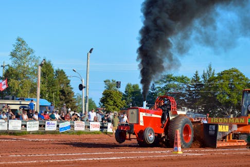 Brandin MacDonald pulls his way down the strip as the only Islander competing in the 8,500 Pro Farm Tractor class at the 40th annual P.E.I. Truck and Tractor Championships Aug. 6 in Crapaud. - Alison Jenkins • The Guardian