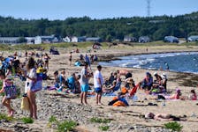 With scorching temperatures over the weekend, Cape Bretoners flocked to local beaches to beat the heat. Dominion Beach was a popular location for beach goers to cool off and enjoy the sun. JEREMY FRASER/CAPE BRETON POST.