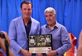 Brad Richards accepts a plaque honouring his inauguration into the P.E.I. Sports Hall of Fame from uncle Jamie Richards Aug. 8 in Murray River.
