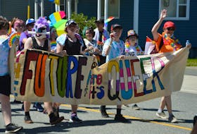 A group of people walks in the Pride Cape Breton parade on Saturday at noon in Sydney. It marked the return of the parade after the last two weren't held due to the COVID-19 pandemic. NICOLE SULLIVAN/CAPE BRETON POST