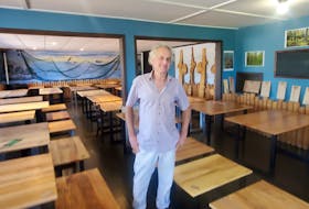 Inverness County resident Neal Livingston stands among a roomful of the handcrafted tables he built from trees on his Cape Breton woodlot and now sells from a restaurant-turned-retail shop on the Cabot Trail in Chéticamp. CONTRIBUTED