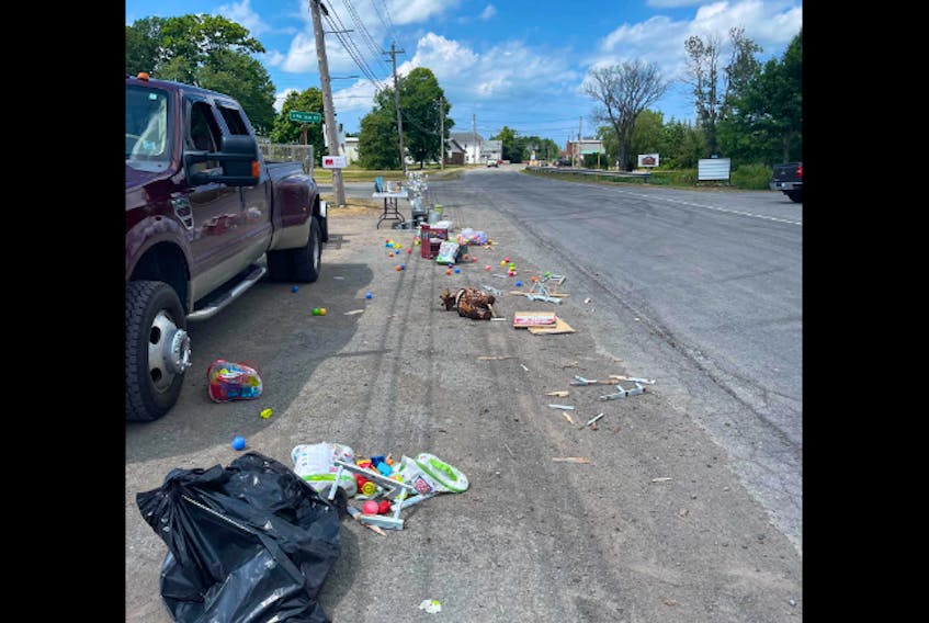 A vehicle ran into tables set up for a yard sale near the Scotsburn Fire Department on Saturday.