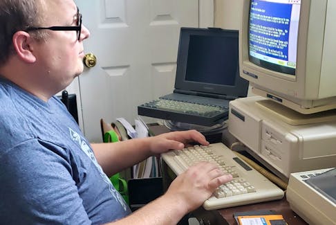 Ryan Hayward fell in love with technology as a kid. Now an IT professional, he's amassed a collection of retro tech like this Tandy1000TX computer. - Contributed