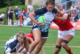 Pictou County's Brooke Reid fights off Team Ontario during the Rugby Sevens game at Brock University, St. Catharines, ON. Communications Nova Scotia/ Len Wagg.