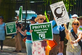 Protesters rallied outside Province House on Tuesday, July 26, expressing concerns about environmental issues, including protecting the Eisner Cove wetland. The Protect Our Southdale Wetland Society is appealing the provincial government's decision to allow the construction of a road through the wetland. File.