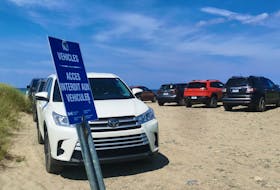 Ali Anningson shot this photo of a number of vehicles shown parking beyond a 'No vehicles' sign at the beach at Big Glace Bay Lake. CONTRIBUTED
