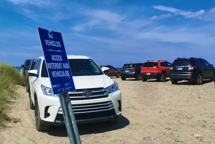 Ali Anningson shot this photo of a number of vehicles shown parking beyond a 'No vehicles' sign at the beach at Big Glace Bay Lake. CONTRIBUTED