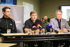 (From left) Justice and Public Safety Minister John Hogan, Premier Andrew Furey and Transportation and Infrastructure Minister Elvis Loveless provide an update Tuesday on massive wildfires in central Newfoundland and their impact on people and communities, at the Provincial Emergency Operations Centre in St. John’s. GLEN WHIFFEN • THE TELEGRAM
