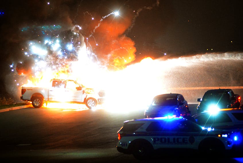 A suspicious fire destroyed five pickup trucks at Cabot Ford on Kenmount Road Wednesday night. Keith Gosse/The Telegram