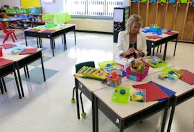 Grade 1 teacher Lynn Hogan prepares school supplies for distribution to kids at Glen Stewart Primary in Stratford on September 1. A public health plan for the September 7 return to classes encourages booster doses of COVID-19 vaccines and handwashing but does not require masking. - Stu Neatby