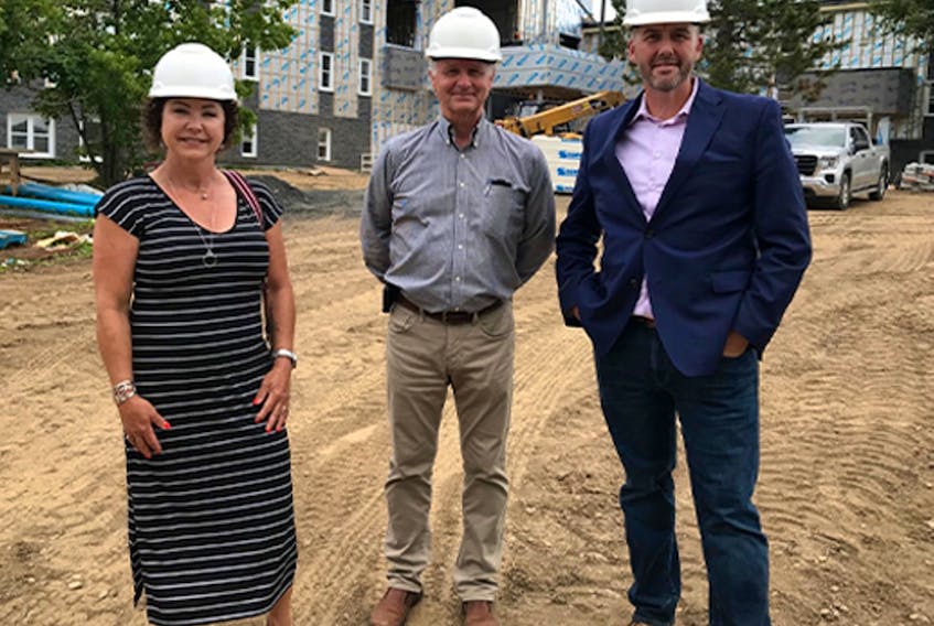 Shelley Woolfrey, left, chair of the Every Moment Matters Campaign, Ken Dicks, board member of Lionel Kelland Hospice, met with Mark Lane, impact manager for Rural Newfoundland and Labrador, The Northpine Foundation, visit the site of the new Lionel Kelland Hospice. Contributed