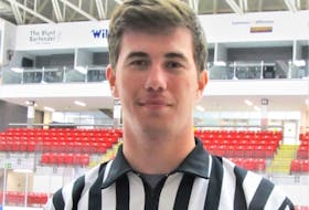 Shown at ice level at the Rath Eastlink Community Centre is Max Ashton, a local hockey referee and linesman.