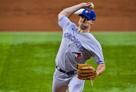 Blue Jays starting pitcher Ross Stripling  pitches against the Texas Rangers during the first inning at the Globe Life Field.