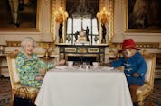 Undated image of Britain’s Queen Elizabeth and Paddington Bear having cream tea at Buckingham Palace taken from a film that was shown at BBC’s Platinum Party at the Palace. Released June 4, 2022.