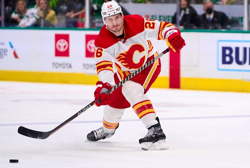 DALLAS, TX - MAY 13:  Michael Stone #26 of the Calgary Flames passes the puck against the Dallas Stars during the second period in Game Six of the First Round of the 2022 Stanley Cup Playoffs at American Airlines Center on May 13, 2022 in Dallas, Texas.