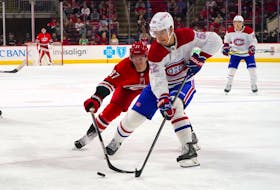 Montreal Canadiens defenceman Justin Barron (52)   controls the puck against Carolina Hurricanes’   Andrei Svechnikov   during and NHL game on March 31. James Guillory-USA TODAY Sports