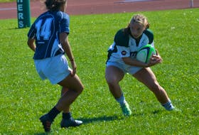 The UPEI Panthers’ Maddy Clements of Tyne Valley looks to avoid a St. Francis Xavier X-Women tackler during an Atlantic University Sport women’s rugby game at MacAdam Field in Charlottetown on Sept. 10. The Panthers won the game 32-5. Jason Simmonds • Journal Pioneer