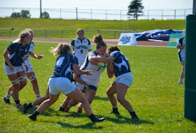 The UPEI Panthers’ Emily Duffy, 1, battles her way towards the end zone to score a second-half try against the St. Francis Xavier X-Women on Sept. 10. The Panthers opened the 2022 Atlantic University Sport women’s rugby regular season with a 32-5 victory at MacAdam Field on the UPEI campus in Charlottetown. Jason Simmonds • The Guardian