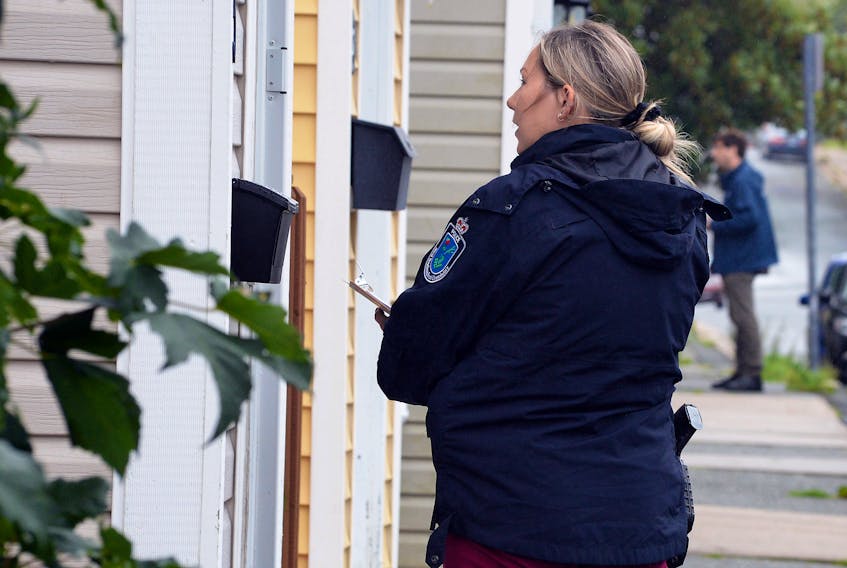 An RNC officer speaks to a resident of a home on Beaumont Street Tuesday morning following two apparently random but violent home invasions that happened in St. John’s Monday night.

Keith Gosse/The Telegram