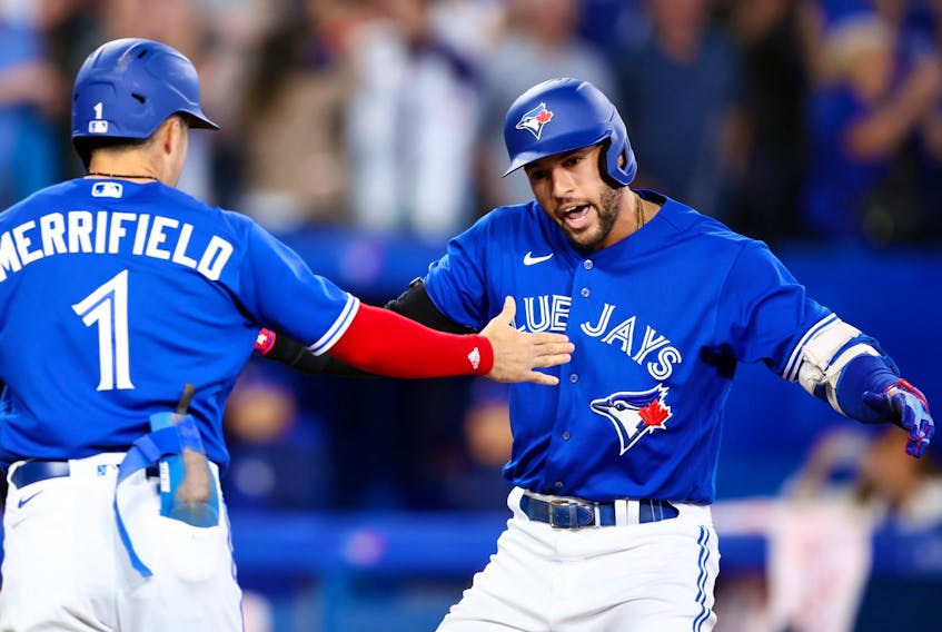 George Springer, rightl of the Toronto Blue Jays celebrates with Whit Merrifield after hitting a two-run home run in the seventh inning during game two of a doubleheader against the Tampa Bay Rays at Rogers Centre on Sept. 13, 2022 in Toronto.