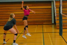 Gwen Coggins gets ready to hit the ball as teammate Amelia Murphy provides support during a recent practice for the Kensington Torchettes. The 47th edition of the Kensington Intermediate-Senior High School Volleyball Extravaganza takes place Sept. 16-17. Jason Simmonds • The Guardian
