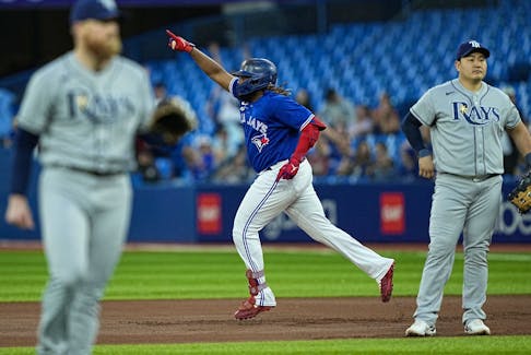 Blue Jays' Vladimir Guerrero Jr. celebrates as he rounds the bases on his solo home run against the Tampa Bay Rays during the first inning at Rogers Centre. It was Vladdy's first homer since August and the 100th of his career.