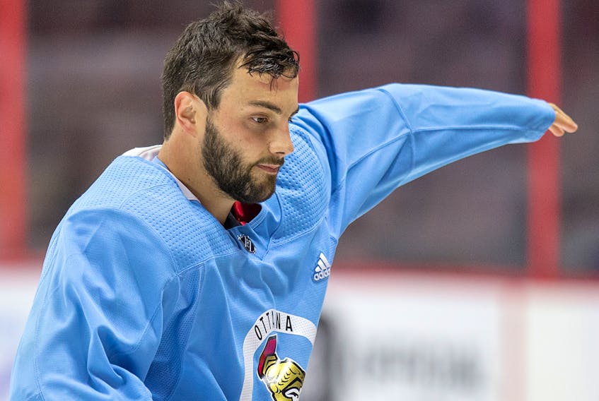 Derick Brassard changes into a blue "non contact" jersey at Senators practice in 2017. 