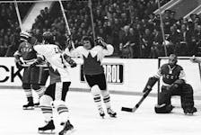 MOSCOW - SEPTEMBER 28, 1972:  Paul Henderson #19 (with helmet) and Bobby Clarke #28 of Team Canada celebrate Henderson's series-winning goal in Game 8 of the 1972 Summit Series between Canada and the Soviet Union at the Luzhniki Ice Palace in Moscow, Soviet Union on September 28, 1972.