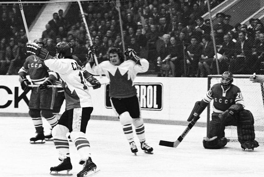 MOSCOW - SEPTEMBER 28, 1972:  Paul Henderson #19 (with helmet) and Bobby Clarke #28 of Team Canada celebrate Henderson's series-winning goal in Game 8 of the 1972 Summit Series between Canada and the Soviet Union at the Luzhniki Ice Palace in Moscow, Soviet Union on September 28, 1972.