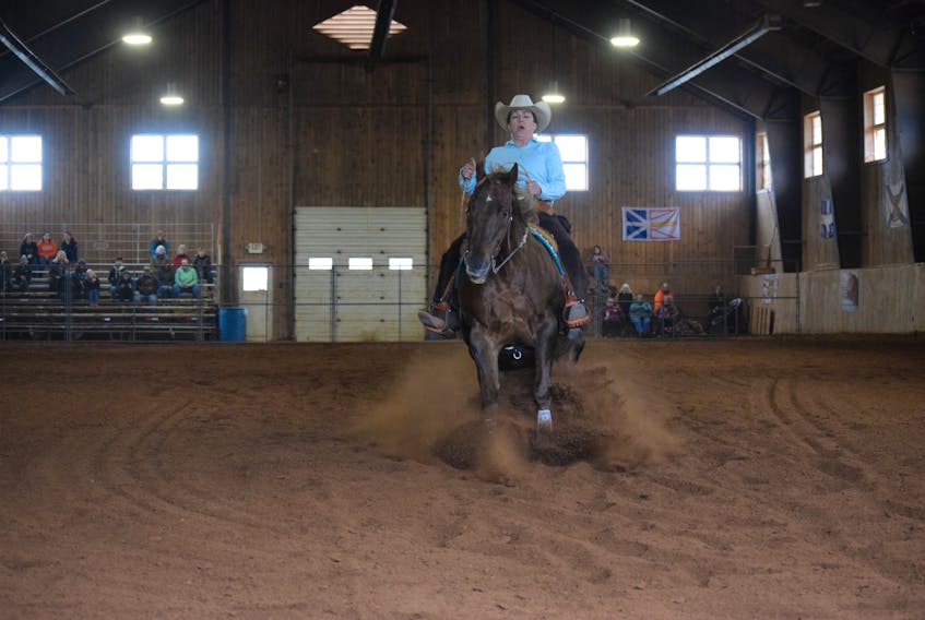 Leah Morrison of Lower Barney’s River and her horse Rob’s Last Twist compete in the Sumac Slide reining competition at Sumac Farms on Friday, Sept. 16.