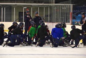 Members of the Joneljim Cougars are shown getting instructions for a drill from head coach Michael Lyle during the club’s practice at the Emera Centre Northside in North Sydney on Thursday. The Cougars will open the Nova Scotia Under-15 Major Hockey League season this weekend on the road against the Western Hurricanes in Liverpool. JEREMY FRASER/CAPE BRETON POST.