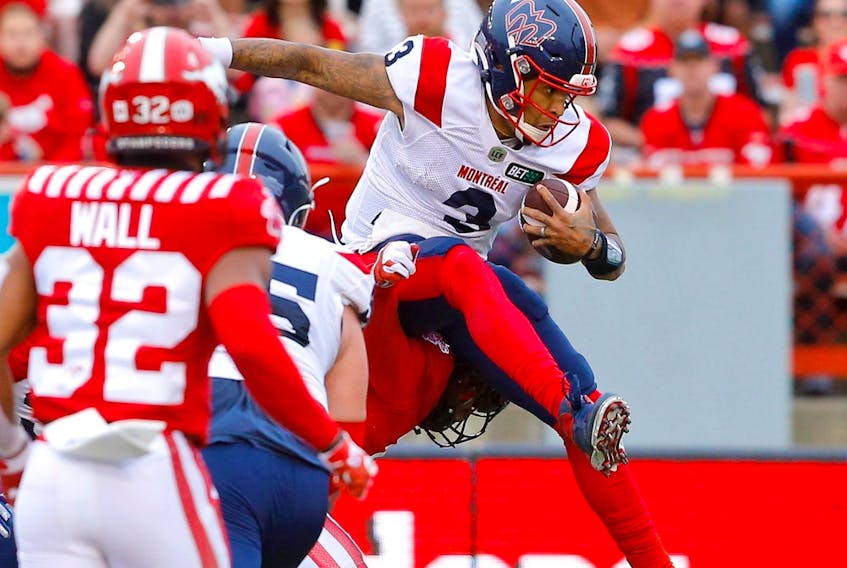 Quarterback Vernon Adams Jr., then with the Montreal Alouettes, leaps in for a touchdown against the Calgary Stampeders at McMahon Stadium in Calgary on June 9, 2022. 