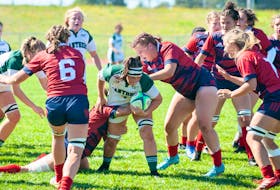 Brinten Comeau, 7, of the UPEI Panthers battles through tackle attempts by the Acadia Axewomen. The action took place during an Atlantic University Sport women’s rugby game at MacAdam Field in Charlottetown on Sept. 17. UPEI defeated Acadia 38-5 to move to 2-0 (won-lost) early in the 2022 regular season. Janessa Hogan Photo • Courtesy of UPEI Athletics