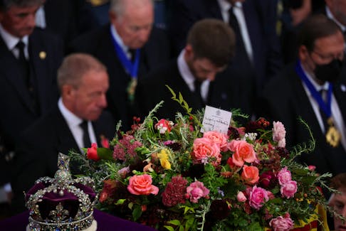A message from Britain's King Charles is seen on Queen Elizabeth's coffin during her state funeral at Westminster Abbey in London on Monday, Sept. 19, 2022. - Phil Noble / Reuters / Pool
