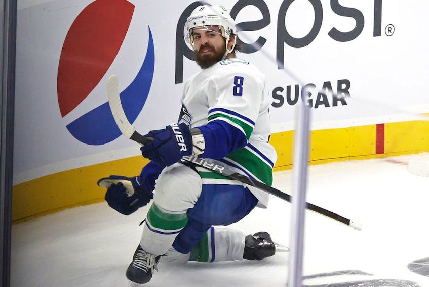 Conor Garland #8 of the Vancouver Canucks celebrates after scoring a goal against the Seattle Kraken in the third period during the Kraken's inaugural home opening game on October 23, 2021 at the Climate Pledge Arena in Seattle, Washington.
