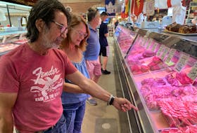  Jeff Uyeee and Michelle Metzger shop for meat in St. Lawrence market Tuesday, Sept 20. SCOTT LAURIE/TORONTO SUN
