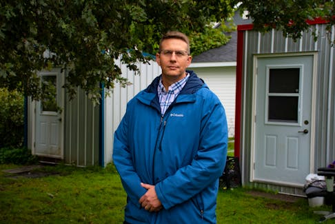 John Stevens, the church shelter project manager with the Archdiocese of Halifax-Yarmouth, poses for a photo in front of two shelters on the grounds of the Saint Theresa Catholic Church on Tuesday, Sept. 20, 2022.
Ryan Taplin - The Chronicle Herald