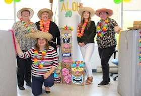 With the effects of hurricane Fiona forecasted to hit Cape Breton this weekend, it only seemed appropriate that provincial court staff at the Sydney Justice Centre spent Thursday wrapped in the warmth of Hawaii. Staff on each floor of the courthouse chose a different theme as part of a staff fun day. From left are Danita MacNeil, Michele Simmons, Miranda McInnis, Meghan Brushett and, in front, Kari MacPherson. CAPE BRETON POST PHOTO