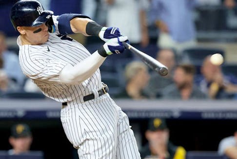 New York Yankees right fielder Aaron Judge hits a ground rule double against the Pittsburgh Pirates during the fifth inning at Yankee Stadium. 