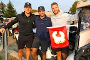  Nazem Kadri, centre, pictured with MacKenzie Weegar, left, and Jonathan Huberdeau at a Flames charity golf tournament on Sept. 14.