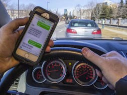 According to a Canadian Automobile Association survey, nearly 80 per cent of Canadian drivers admit to being distracted while driving. Postmedia Network file