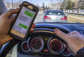 According to a Canadian Automobile Association survey, nearly 80 per cent of Canadian drivers admit to being distracted while driving. Postmedia Network file